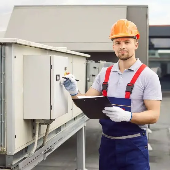 HVAC professional inspecting climate-system controls during a service visit